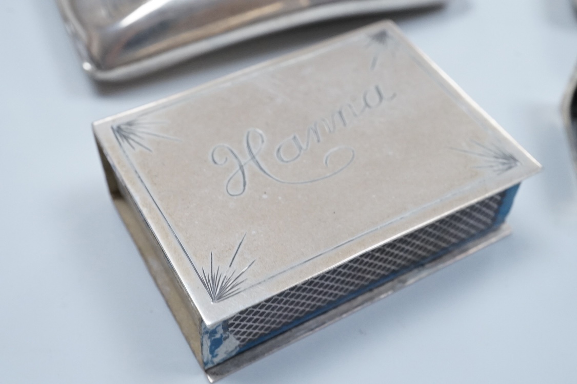 Two North American Edward I. Farmer of New York engraved sterling matchbox slides, one mounted with a jadeite carving, the other with polychrome enamelled surmount, both approximately 60mm.